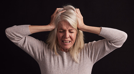 Image showing Senior woman, stress or anxiety on black background in studio in schizophrenia, bipolar disorder or psychology burnout. Retirement elderly, anxiety or mental health headache with fear, pain or crisis