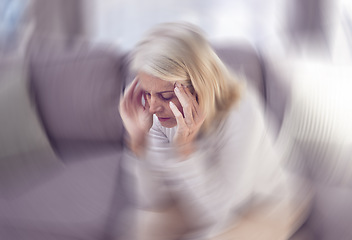 Image showing Senior woman, headache and sofa in home with motion blur, pain and depressed while tired in retirement. Elderly, old woman and anxiety with burnout, depression and panic attack on couch at house