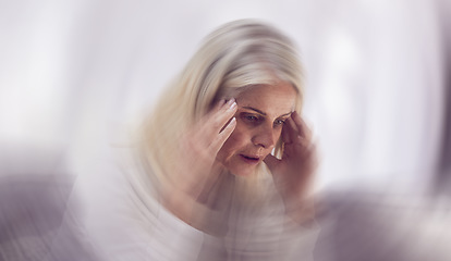 Image showing Senior woman, headache and dizzy motion blur on sofa for mental health, stress and health risk. Elderly person, tired and suffering from migraine for dementia crisis or head pain in retirement home