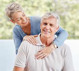 Image showing Happy senior couple hug in home, house and apartment while relaxing in lounge for love, care and retirement together in Australia. Happiness, smile and old man, woman and people enjoy quality time