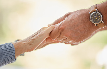 Image showing Holding hands, support and trust with senior couple, love and solidarity with helping hands and partnership outdoor. Help, commitment and faith, elderly people with hand holding, together and love.