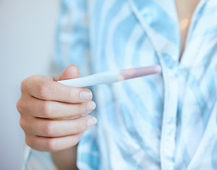 Image showing Pregnancy test, woman and hands check results of medical information at home. Closeup, fertility stick or family planning for maternity wellness, pregnant hormone or ivf healthcare treatment for baby