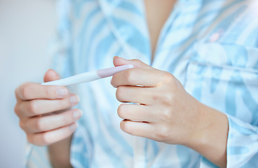 Image showing Pregnancy, test and hands of woman with results for future family, children and baby in bathroom. Healthcare, motherhood and closeup of girl holding home pregnant kit testing for fertility wellness