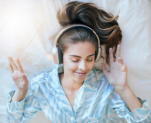 Image showing Woman, headphones and music, listening in bed to relax at home, podcast or radio streaming, peace and satisfaction. Young, wellness and positivity in bedroom, mindset and self care listen and freedom