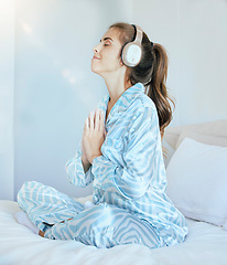 Image showing Woman, headphones and morning meditation in bedroom for wellness, mindfulness and chakra energy, zen fitness or peace. Happy girl, yoga exercise and music for namaste prayer, mindset or mental health