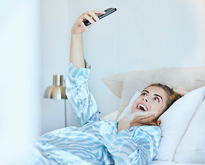 Image showing Selfie, girl in bed and photography with phone, technology and memory, smile and happy, young gen z with social media content creation. Happiness in picture, morning and smartphone, wifi 5g network.