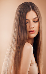 Image showing Hair care, beauty and woman on studio background for cosmetics, makeup and shampoo for shine, growth and strong texture hairstyle. Face of brunette posing for hairdresser or luxury salon product