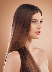 Image showing Woman, face or skincare glow and hair style, keratin treatment or dermatology healthcare on studio background. Beauty model, brunette color or facial makeup cosmetics in texture wellness or collagen