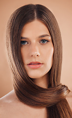 Image showing Portrait, hair care or woman with cosmetics, texture or natural beauty on brown studio background. Female, straight hair or organic growth for hairstyle, keratin or hair dye advertising for marketing