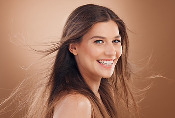 Image showing Beauty, hair and face with woman in hair care and facial treatment marketing with keratin and smile against studio background. Makeup, natural cosmetics and mockup, happy model and skincare.