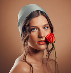 Image showing Rose, woman and face with natural beauty, skincare and luxury cosmetics of floral aesthetic, perfume or facial makeup on studio background. Headshot, portrait and model with roses, nature and flowers