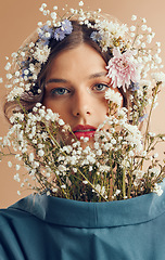 Image showing Woman, beauty portrait or flowers closeup for nature cosmetics, makeup or fashion at studio in spring. Flower crown model, facial plants or natural aesthetic for cosmetic, organic clothes or face art