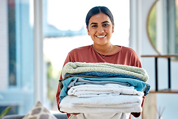 Image showing Portrait, cleaning or woman with laundry or happy smile after washing clothes or towels in cleaning services. Hospitality, hotel or face of Indian cleaner working at a airbnb, house or home in Mumbai