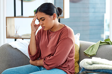 Image showing Stress, woman and headache on sofa, depression and mental health in lounge. Female holding head, anxiety and burnout in living room, suffering from mental illness and sad at home with pain or anxious