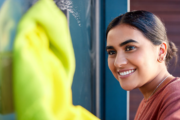 Image showing Woman, cleaning and window washing with a smile to clean windows dirt with water, soap and fabric. Happy Indian person cleaner or maid doing spring cleaning with happiness for housekeeping helping