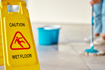 Image showing Spring cleaning, wet or floor with mopping sign on home or office building in hygiene maintenance, healthcare or bacteria wellness. Zoom, information or housekeeping warning board for slipping safety