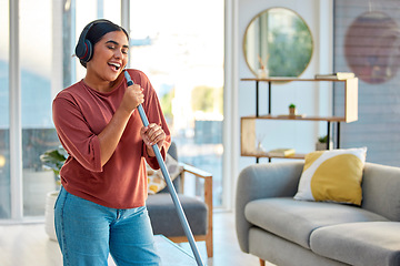 Image showing Singing, cleaning and headphones of a woman with music working in a home dancing with happiness. Spring cleaning, cleaner and happy person sing and dance with a mop in living room listening to audio