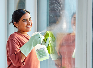 Image showing Glass, spray or woman cleaning a window with liquid soap or chemical product for dusty bacteria or germs at home. Cleaning services, dirty or happy Indian girl cleaner washing glass door with a cloth