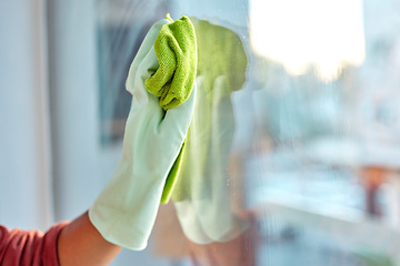 Image showing Hand, latex and cloth for window cleaning, hygiene or clean housework and disinfection at home. Hands of cleaner wiping dirty glass for cleanliness, disinfect or anti bacteria and safe housekeeping