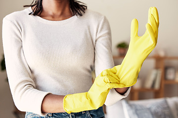Image showing Cleaning, rubber gloves and hands of woman in living room for hygiene, protection and disinfection. Dirt, dust and bacteria with girl cleaner at home for sanitary, housekeeping and domestic chores