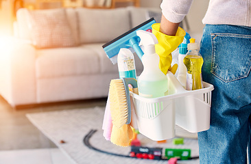 Image showing Cleaning, hand and basket of cleaning supplies for family home hygiene with a brush, bottles and gloves. Woman, cleaning supplies and housekeeper about to clean a home for spring cleaning