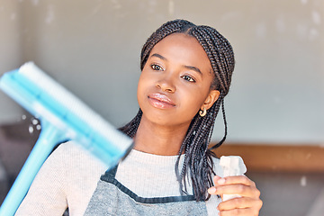 Image showing Cleaning, window and black woman with water for chores, housework and spring cleaning a house. Washing, spray and African cleaner with products for housekeeping, home care and disinfection of glass