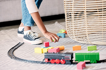 Image showing Mother, cleaner or babysitter woman hands cleaning kids toys and mess in a living room. Helping nanny or mom with care in a family house clean children play toy off the floor carpet in a home lounge