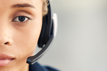 Image showing Closeup, face or woman in call center, crm professional or customer service with focus, vision or headset. Communication expert, customer support worker or contact us at office in zoom of microphone