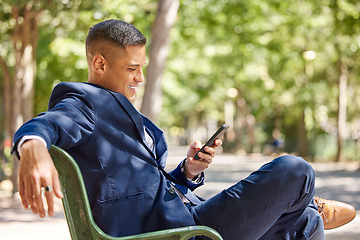 Image showing Phone, business man and typing at park, social media or internet browsing. Relax break, mobile tech and male employee sitting outdoors with 5g smartphone for networking, messaging or web scrolling.