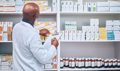 Image showing Pharmacy, senior man and checklist clipboard for stock, inventory and pills, prescription and checking. Pharmacist, writing and black man counting medical product, medicine and treatment for record