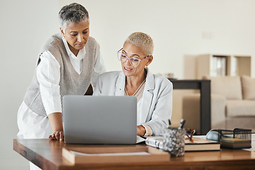 Image showing Laptop, office and senior business women in collaboration planning a corporate project together. Teamwork, professional and elderly manager helping a mature employee with a report in the workplace.