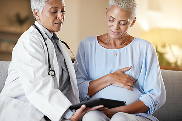 Image showing Pregnant, woman and senior doctor on digital tablet for planning, results and discussion on sofa during home checkup. Healthcare, pregnancy and consulting with mature doc while checking online plan