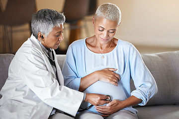 Image showing Healthcare, consulting and pregnant woman with doctor on sofa for examination, checkup and baby health during home visit. Senior woman, pregnancy and medical professional doing exam on happy patient