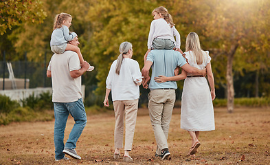 Image showing Big family, walking and relax together in nature park for summer vacation, holiday enviroment and sunshine outdoor. Grandparents, parents and children walk for quality time or bonding for happiness