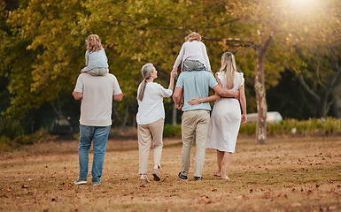 Image showing Big family, park and nature walking of mother, grandparent and children with love and care. Happy family, outdoor and autumn field walk on vacation with grandmother, dad and girl back together