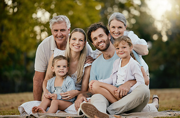 Image showing Family picnic, park portrait and smile with kids, parents or grandparents for bonding together, love or relax. Happy family, nature and generation care with children, mom and dad in summer sunshine