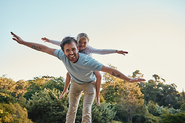 Image showing Family, love and airplane game with girl and father in a forest for playing, fun and bonding in nature, happy and smile. Happy family, man and child enjoy fantasy game, freedom and laughing in park