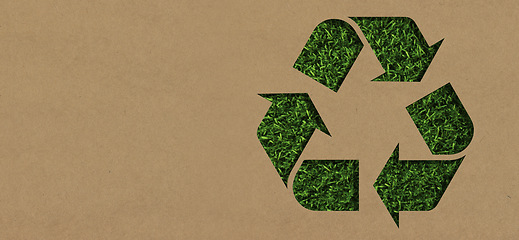 Image showing Grass, mockup and cardboard with recycle arrow for sustainability, environment and package pollution. Recycling, earth day and energy with eco friendly sign for reusable, clean energy and nature