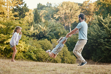 Image showing Nature, park and father playing with girls while on outdoor adventure, journey or exploring. Happiness, freedom and dad having fun with children in green garden while on weekend getaway or vacation.