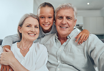 Image showing Love, family and portrait by girl and grandparents on sofa for bond, hug and quality time in their home together. Happy family, face and senior man with woman relax with grandchild while babysitting