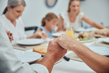 Image showing Big family, holding hands and pray before food with love, care and god worship before eating. Buffet, prayer and thanksgiving gratitude with family hands of children, grandparent and mother at home