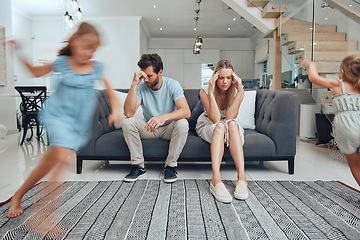 Image showing Tired parents, child energy and parent care burnout with anxiety from adhd children at home. Headache, stress and noise from girl kids in a living room busy with mom and dad on a sofa with fatigue