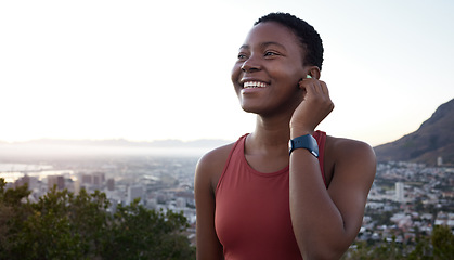 Image showing Fitness, headphones or black woman in nature to start running exercise, cardio workout or marathon training. Sunset, earbuds or happy African girl streaming radio music, podcast or audio playlist