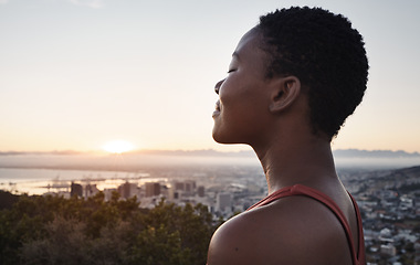 Image showing Fitness, breathing or zen black woman in meditation in nature thinking of wellness goals, vision or target. Healthy, spiritual or peaceful happy African girl smiles or relaxing to meditate at sunset