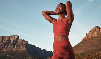 Image showing Freedom, running and mountains with black woman in nature for workout, sports and endurance training. Stamina, cardio and fitness with runner at sunset for adventure, jogging and trekking achievement