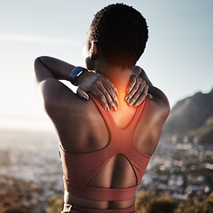 Image showing Back pain, fitness and black woman in nature experience running training accident in mountains. Woman athlete back on a run feeling pain from exercise, runner and workout injury on a mountain path