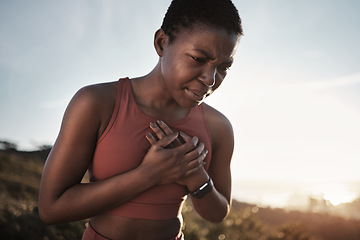 Image showing Black woman, runner and heart attack pain in nature while running outdoors. Sports, cardiovascular emergency and female athlete with chest pain, stroke or cardiac arrest after intense cardio workout.