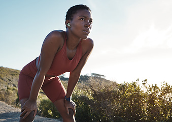 Image showing Tired, motivation and black woman running in nature, training exercise and fitness idea in Morocco. Breathing, relax and African runner thinking of a mountain workout, sports and cardio start