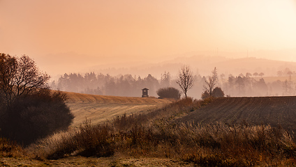 Image showing Autumn foggy and misty sunrise landscape