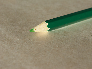 Image showing Green pencil over paper